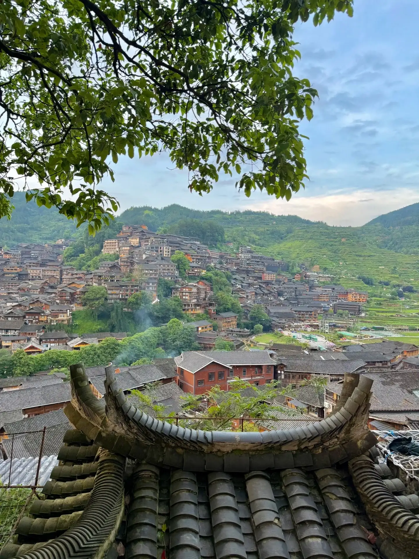 View the rooftops of the Xijiang Thousand-House Miao Village from a vantage point