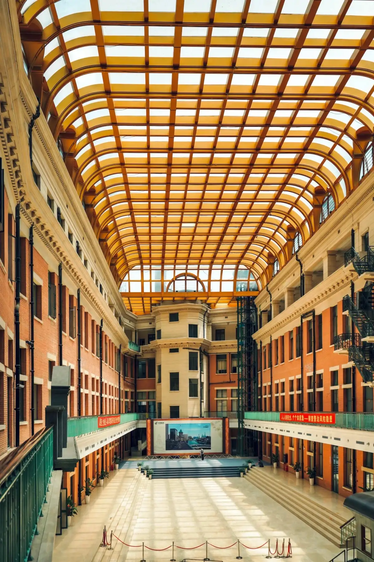 The long, glass-roofed atrium inside the Shanghai Post Office building