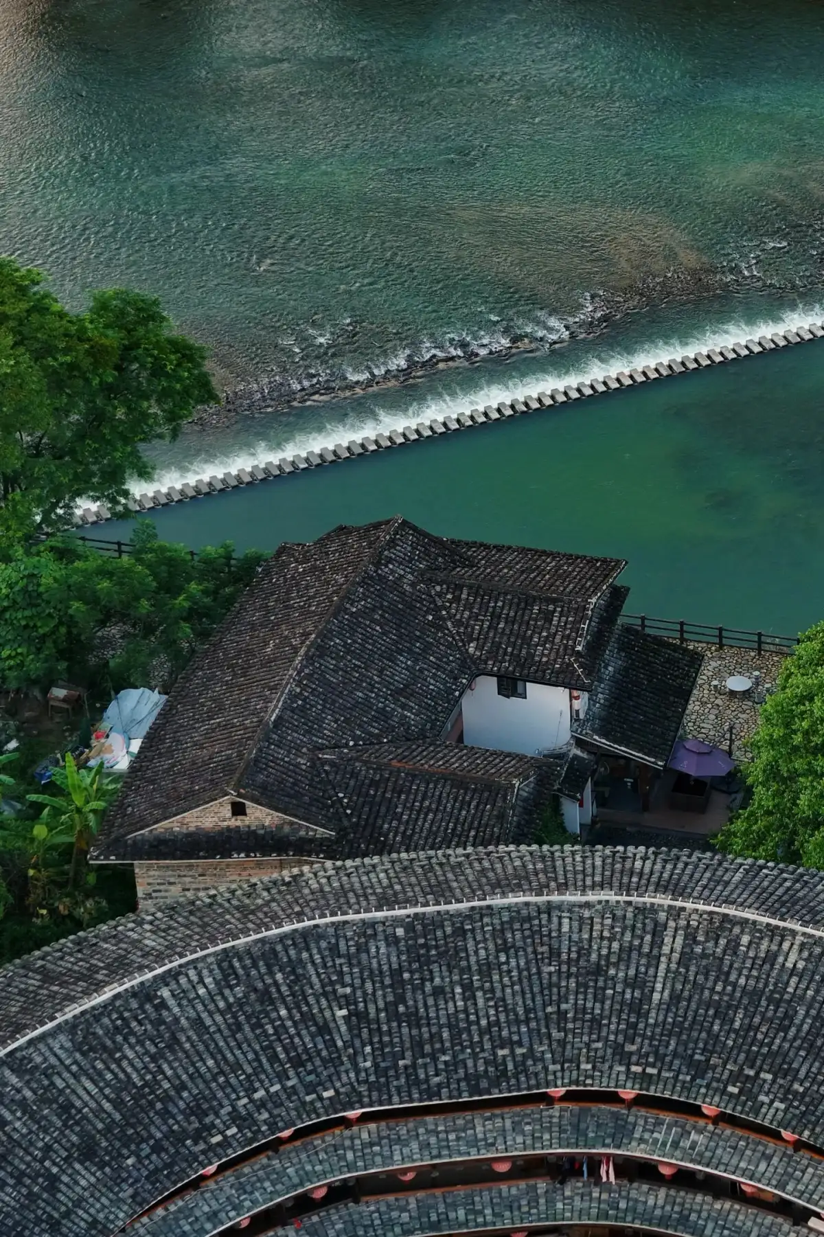 A bird’s-eye view of the inner courtyards and waterways of Fujian’s circular earthen buildings