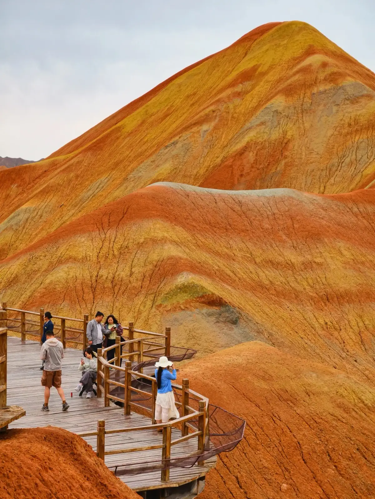 Zhangye’s Seven-Color Danxia Trail and visitors in the distance