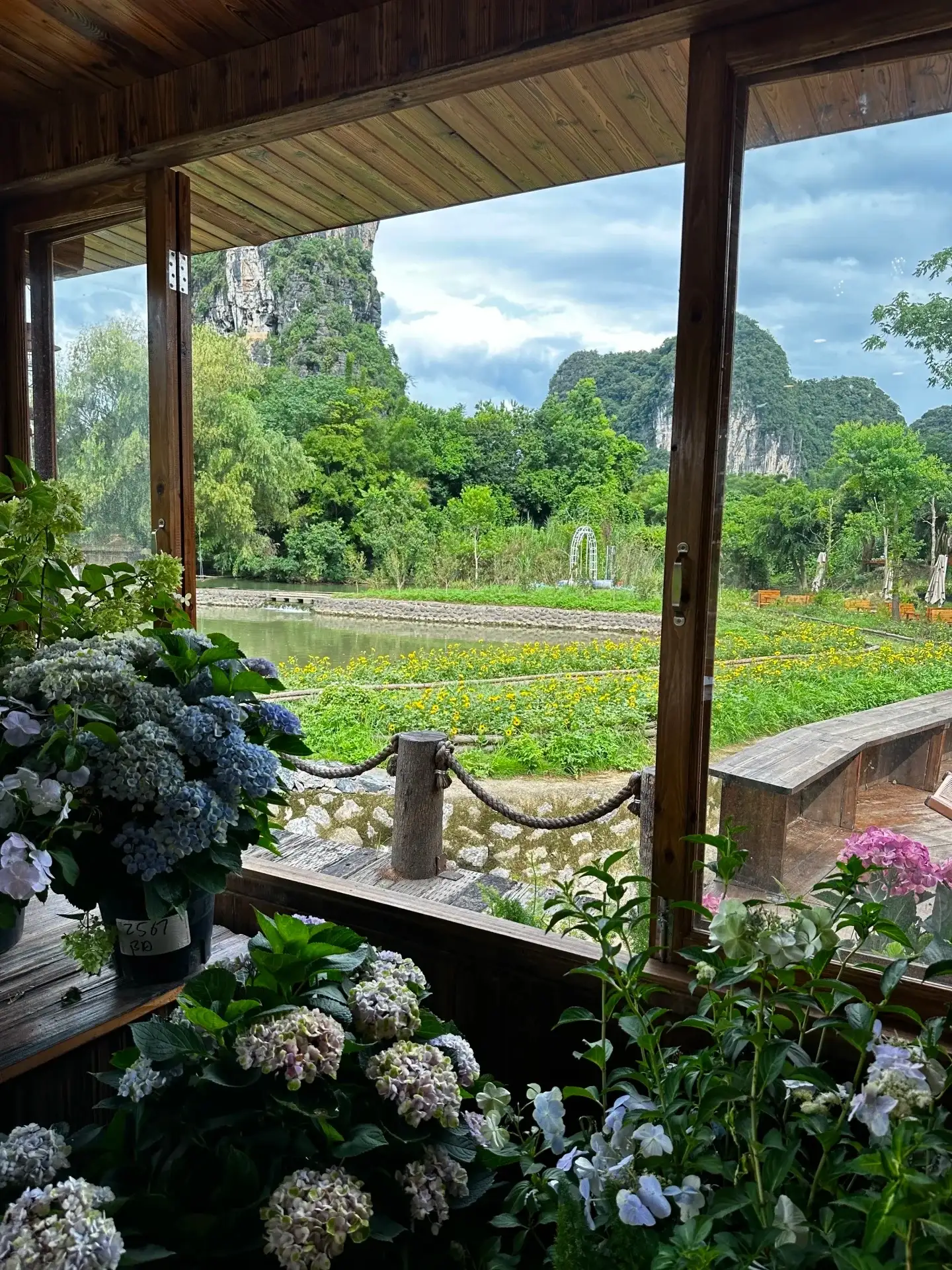 View of the karst peaks and rice paddies from the window of a guesthouse near the Yulong River