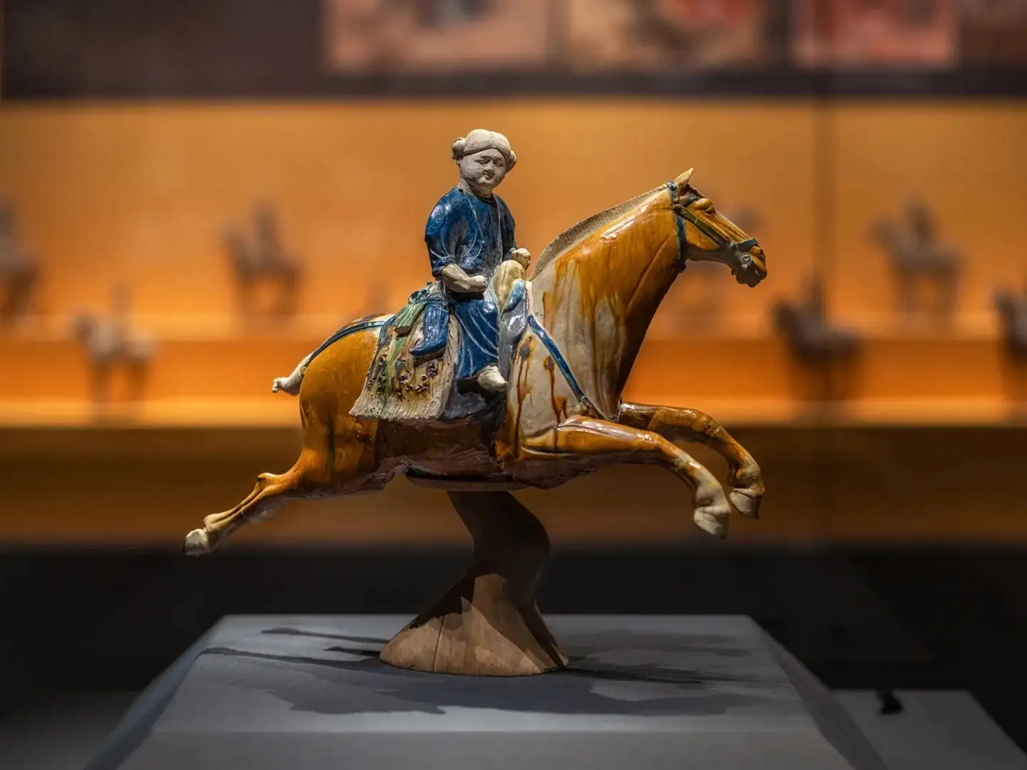 Side view of the “Rider in Blue” and the “Leaping Horse” ceramic sculpture