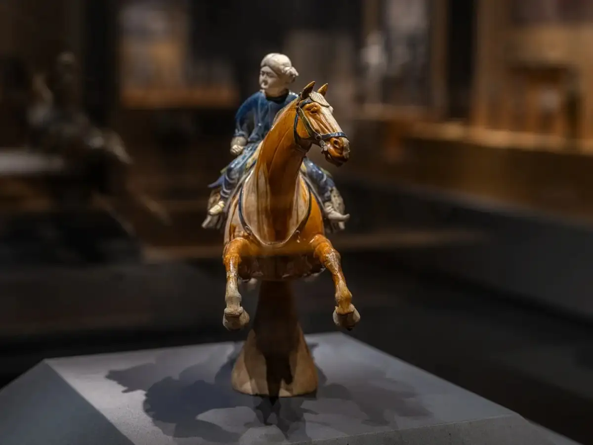 A front-on view of the ceramic sculpture of the rider and horse