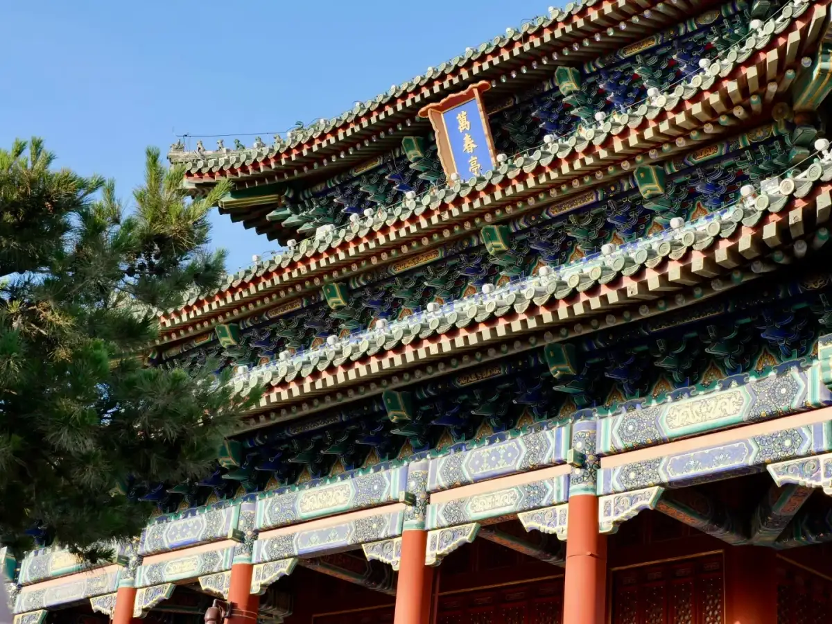 The colorfully painted eaves, plaques, and red columns of the pavilions at Jingshan Park