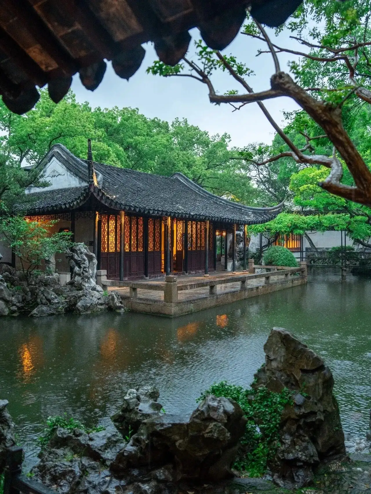 A water pavilion in the rain at Tuisiyuan Garden in Tongli