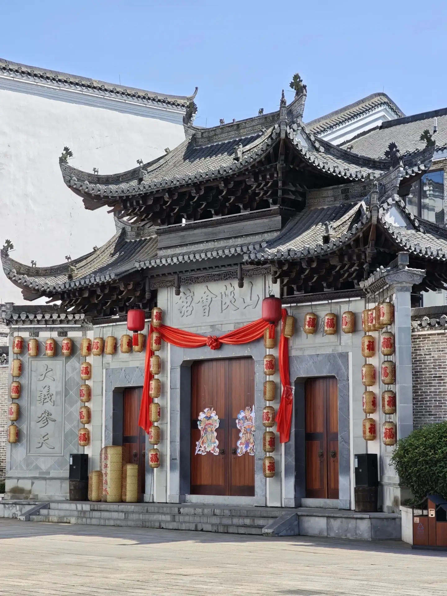 Hongjiang Ancient Commercial City: Guild Hall Facades Featuring Up-Curved Eaves, Red Columns, and Lanterns